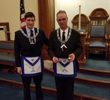Past Master Jubinville presents current Master Ferguson a customized gavel